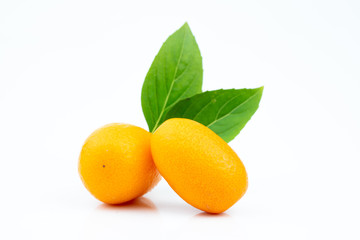 Ripe kumquats on white background