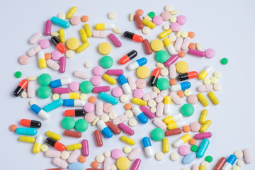 Fototapeta na wymiar Tablets and pills on a white background