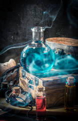 Blue magic potion with smoke Magical concept