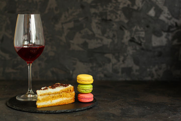 red wine, cake and macaroons, dessert (sweets). food background. top photo