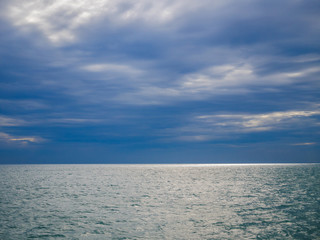 Sea view from gulf of Thailand with the horizon and cloudy sky 