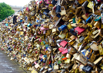 Paris, France, July 05, 2014 Seine River Love Bridge decorated by padlocks, Paris