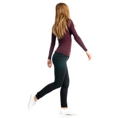 Woman in black jeans and shirt run goes walking on white background isolation, back view