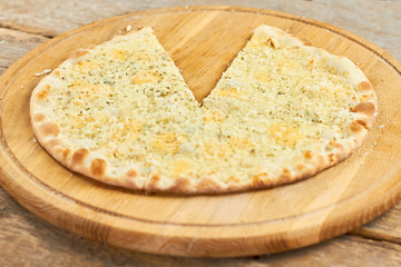 Spicy cheese pizza with removed slice. Lack of one sixth of pizza. Five sixth of pizza.