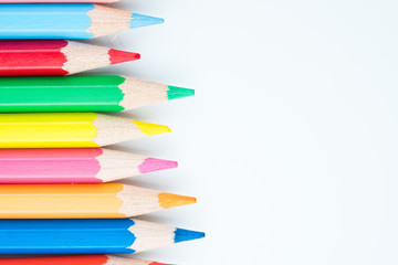 colored pencils on white background