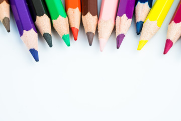 colored pencils on white background