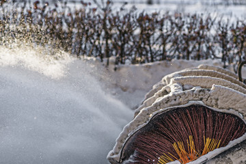 Clearing snow. Tractor clears the way after heavy snow.