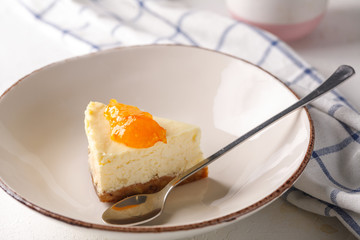 cheesecake with orange jam in a plate