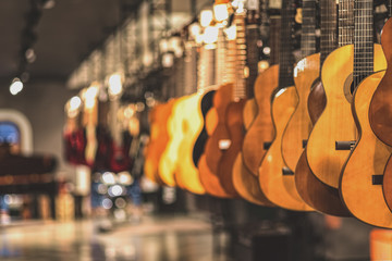 guitars, showcase with guitars hanging in a row