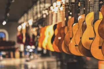 Fototapete Musikladen guitars, showcase with guitars hanging in a row