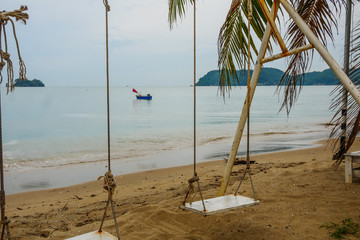 Obraz na płótnie Canvas Lamsing beach beautiful landscape at Chanthaburi,Thailand with swing and boat 