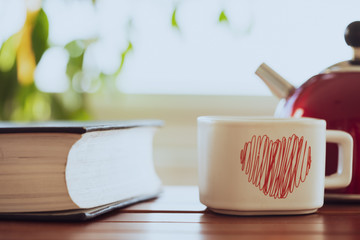 tea-coffe cup on book