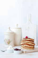 Delicious homemade pancakes with sour cream and jam.