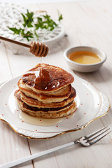 Delicious homemade pancakes with honey