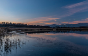 Milada lake in winter cold evening in north Bohemia