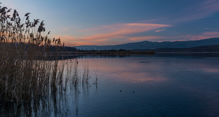 Milada lake in winter cold evening in north Bohemia