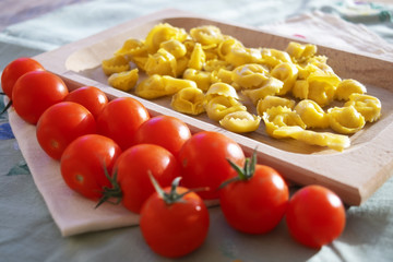 raw tortellini with cherry tomatoes