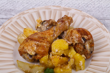 Roasted chicken legs with potato