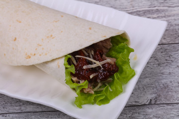 Tortilla with tuna, salad and dried tomato