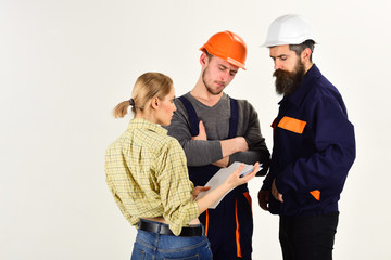 Your project is our business. Men and woman builders work in team. Group of constructing engineers or architects at work. Construction workers team. Professional people working on construction design