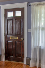 Fototapeta na wymiar antique door with mail slot in clean home