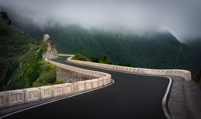 Mountain road in green mountain close to the clouds © Emanuele Colombo