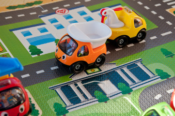 Background from children's toys. Miniature city and small cars.