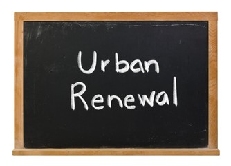 Obraz premium Urban renewal written in white chalk on a black chalkboard isolated on white