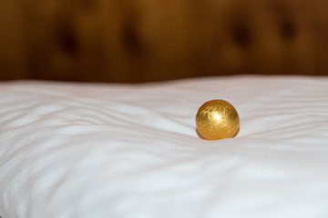 exquisite chocolate ball on coverlet