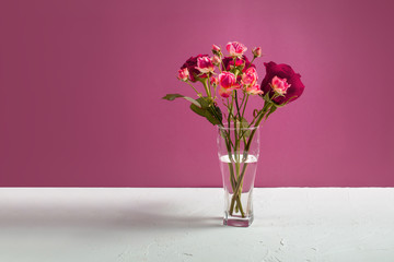 Vase with roses on the table