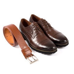 Men's leather shoes and belt on a white background