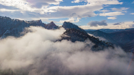Fototapeta na wymiar Aerial mountain fog covered the famous rock Lagonaki in morning light.
