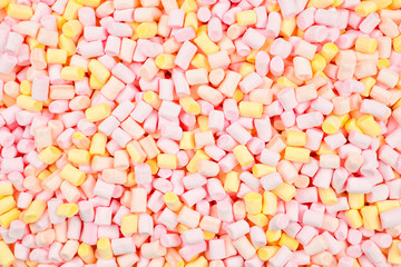 Marshmallow. Background of pink and yellow colorful mini marshmallows.
