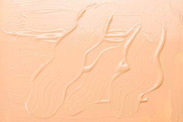 Liquid foundation texture. Make up for women. Top view.