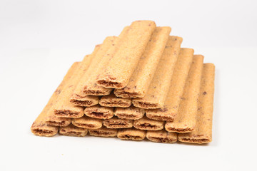 Waffle bar with jam isolated on white. Pyramid of waffers.
