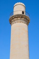 A minaret of a 12th century mosque in Old City of Baku, Azerbaijan