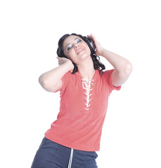 young woman listening to music using headphones