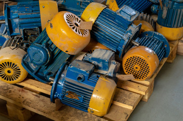 Warehouse of broken electric motors prepared for repair and restoration