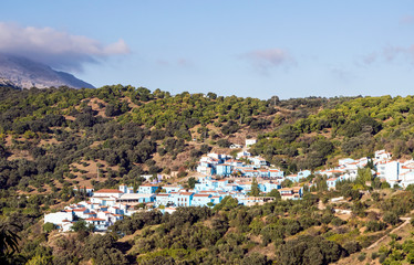 Fototapeta na wymiar Village of white houses in the Sierra de Malaga, in Spain, on a sunny day.
