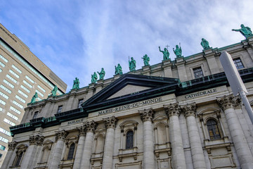 Scenic beautiful view of Cathedral of Marie-Reine-du-Monde (Mary, Queen of the World Cathedral) in Montreal. Depressive winter look of old catholic cathedral in the largest megapolis city of Quebec