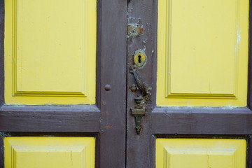 wooden door with lock and knocker