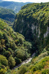 Fototapeta na wymiar Beautiful view of the hiking trail leading to the national Park and famous sights of Georgia Okatse (Okace) Canyon located near Kutaisi. Zeda-gordi caucasus region, Georgia.