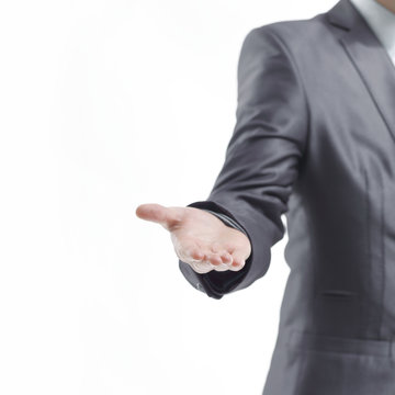 vertical photo.businessman holds out his hand for a handshake