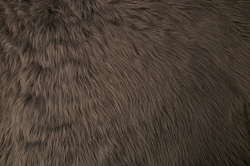 Grey artificial fur background. Fur fabric texture dark background.