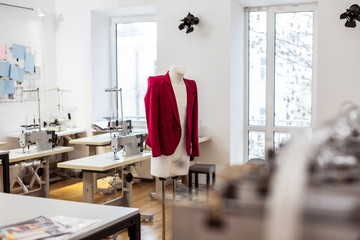 New model of a jacket for women hanging being presented in a showroom