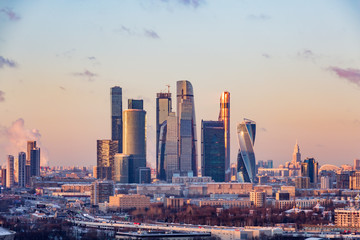 Moscow international business center "Moscow-city". Smoke from the pipes of the combined heat and power plant. Winter evening cityscape.