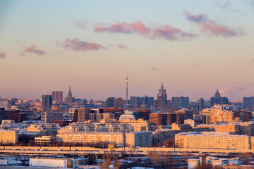Obraz na płótnie Canvas Panorama of evening Moscow. Winter landscape. Ostankino TV tower on the horizon.