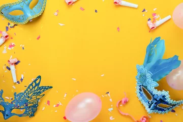 Peel and stick wallpaper Carnival Table top view aerial image of beautiful colorful carnival festival background.Flat lay accessory object the mask & decor confetti and balloon on modern yellow paper at home office desk studio.