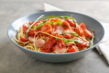 Delicious pasta with sausage and sauce on plate