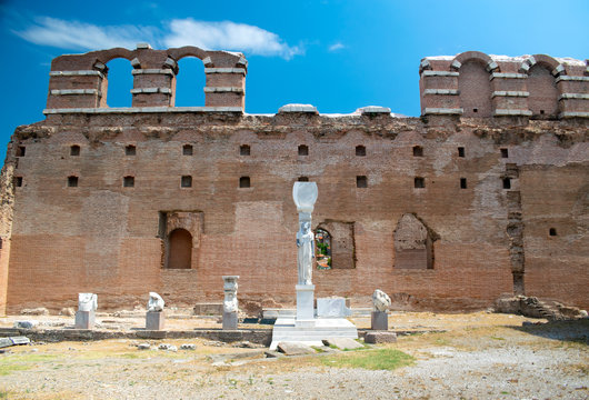 Ruins of ancient red basilica in Pergamum. Temple of the Egyptian Gods. Statue of Egyptian underground god Serapis.